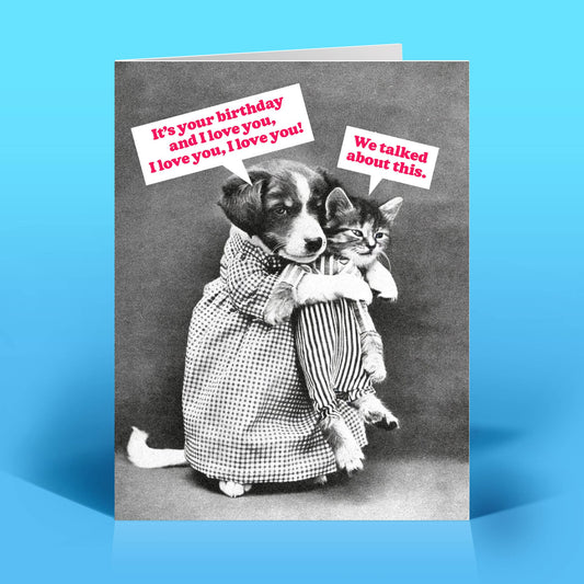 Greeting card with a vintage photo of a dog and holding a cat and text on a blue background