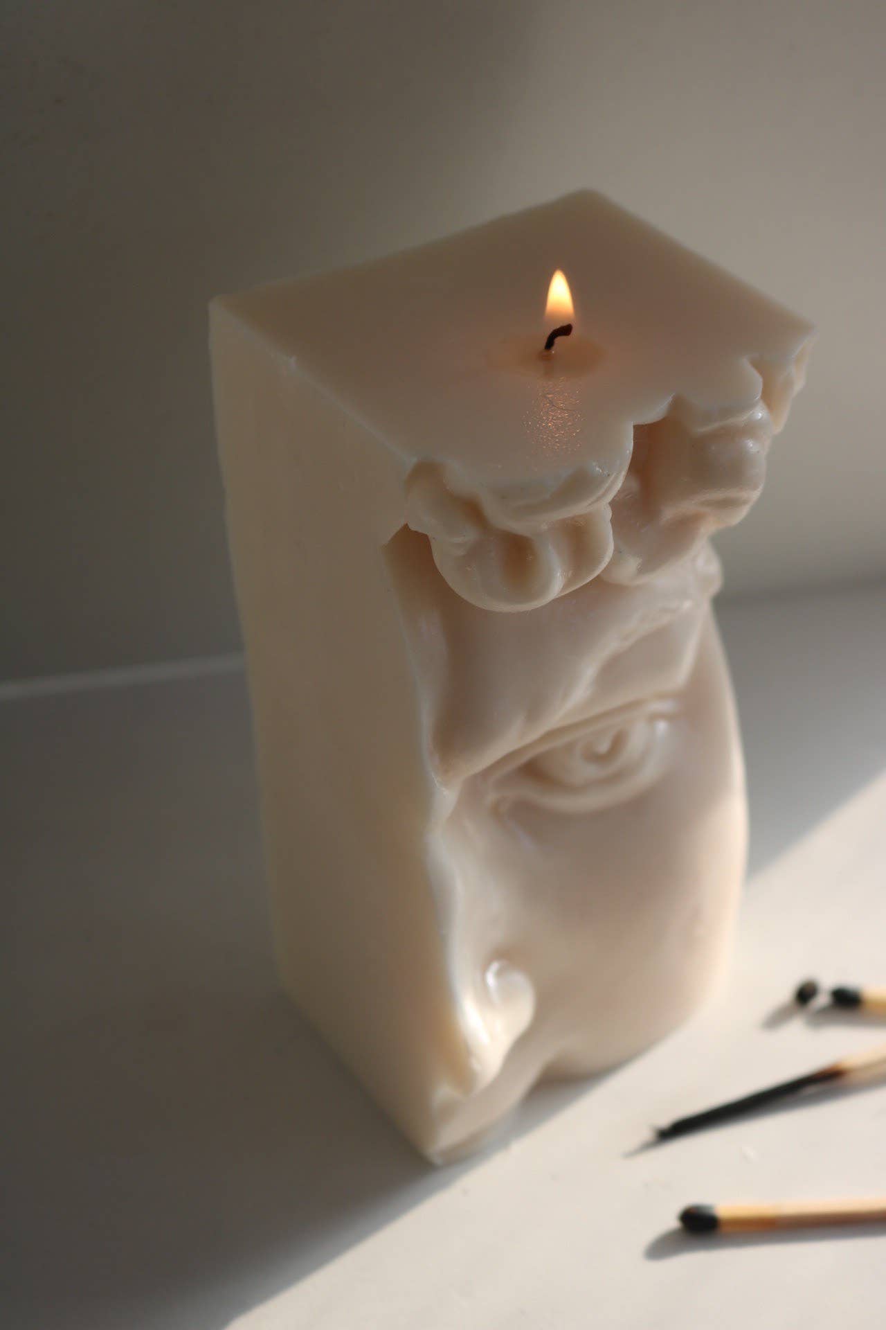 Half David sculptural candle: Natural/White